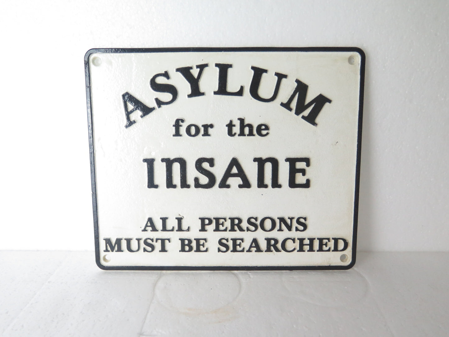 Asylum for the insane sign